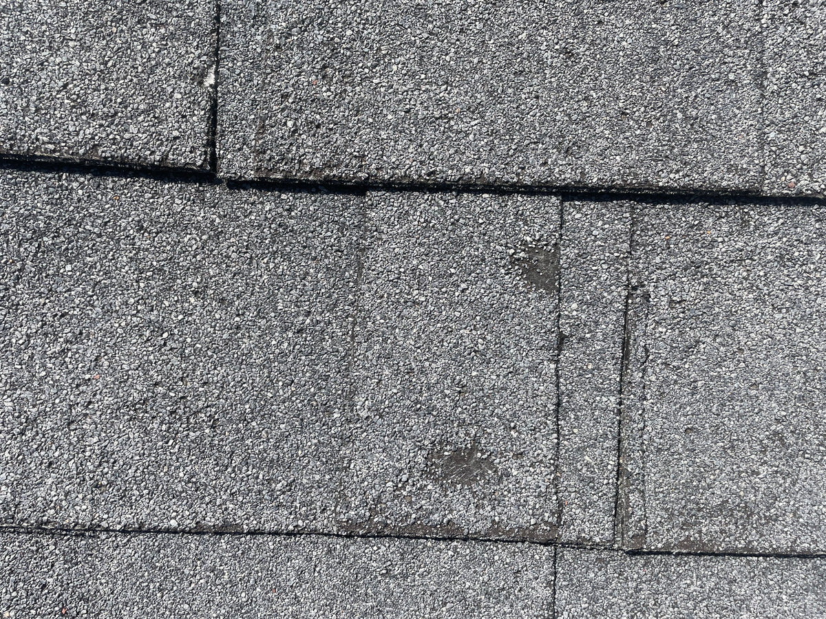 Close up of hail damage on shingle roof in Houston