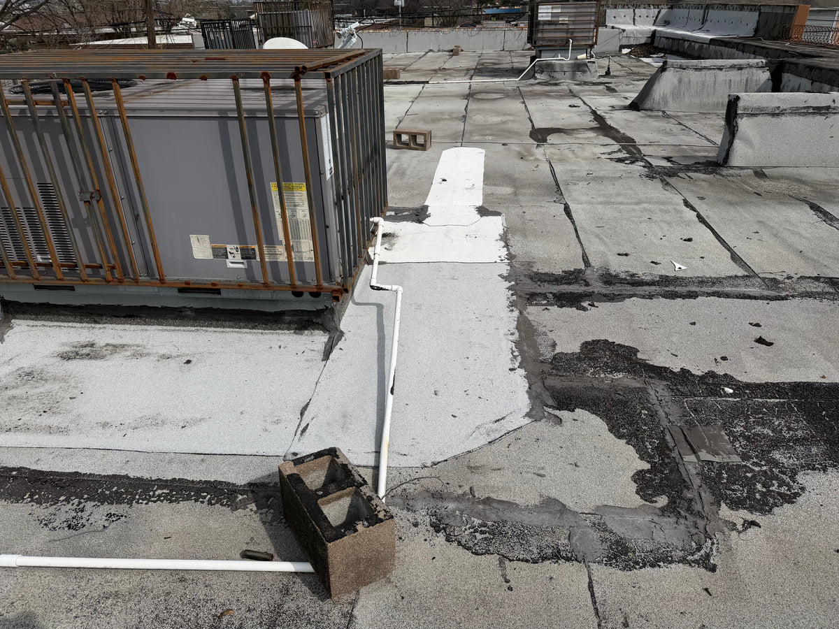 A commercial roof that is old and needs to be replaced soon.