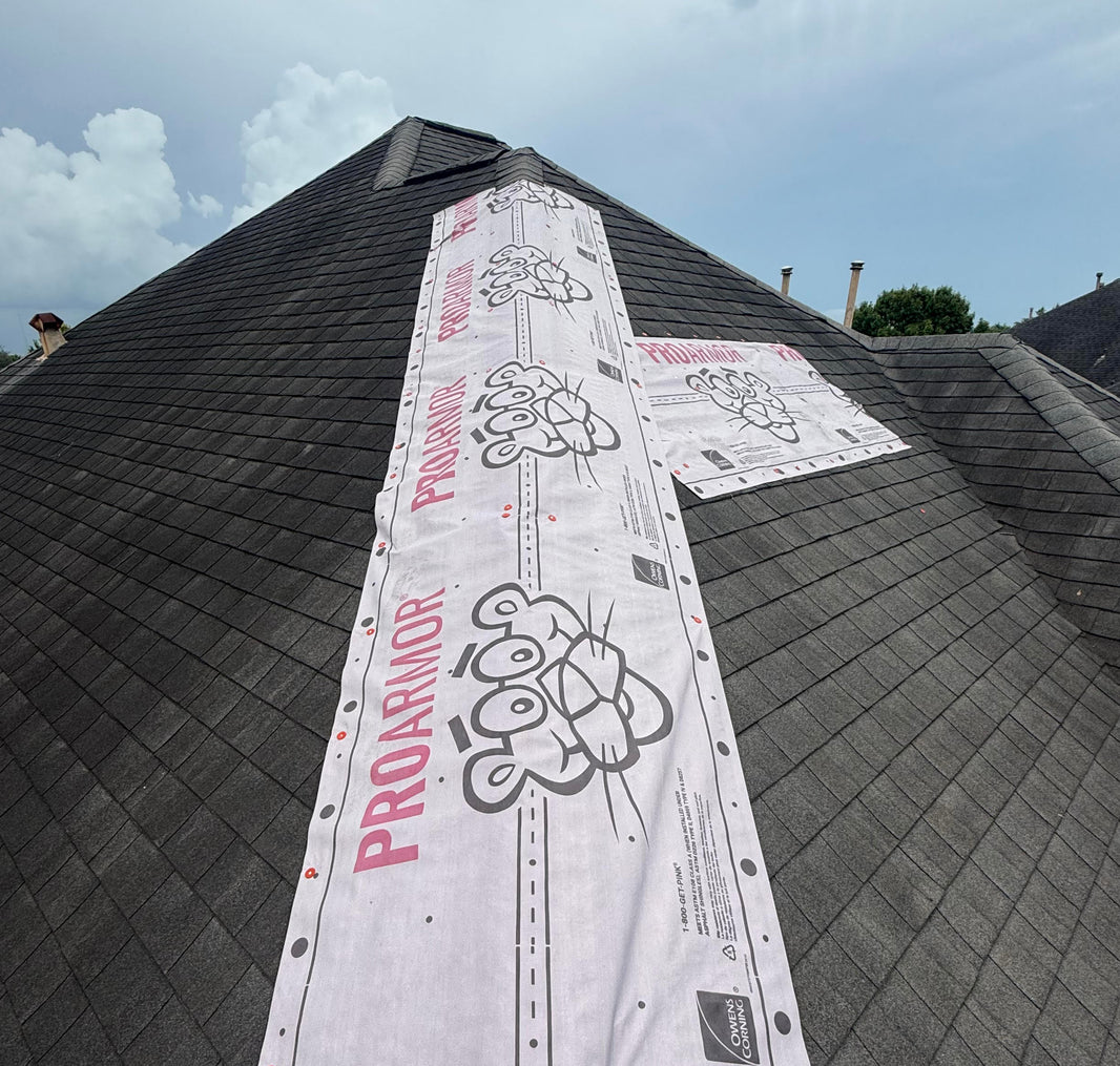 Emergency roof tarp installed to prevent active leaks and protect a home after storm damage