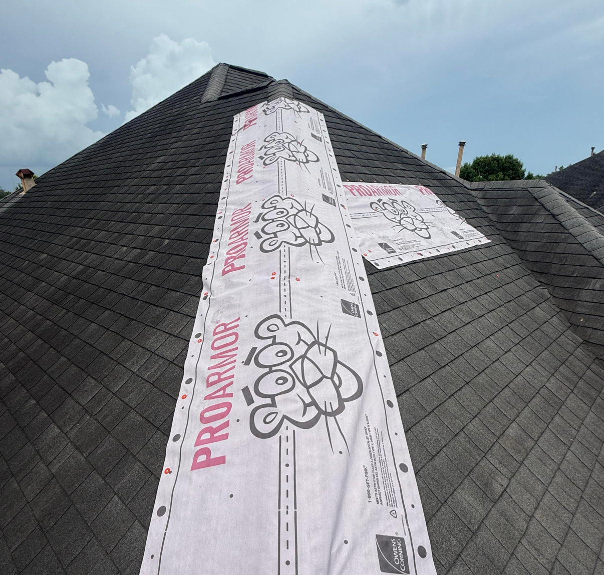 Emergency roof tarp installed to prevent active leaks and protect a home after storm damage