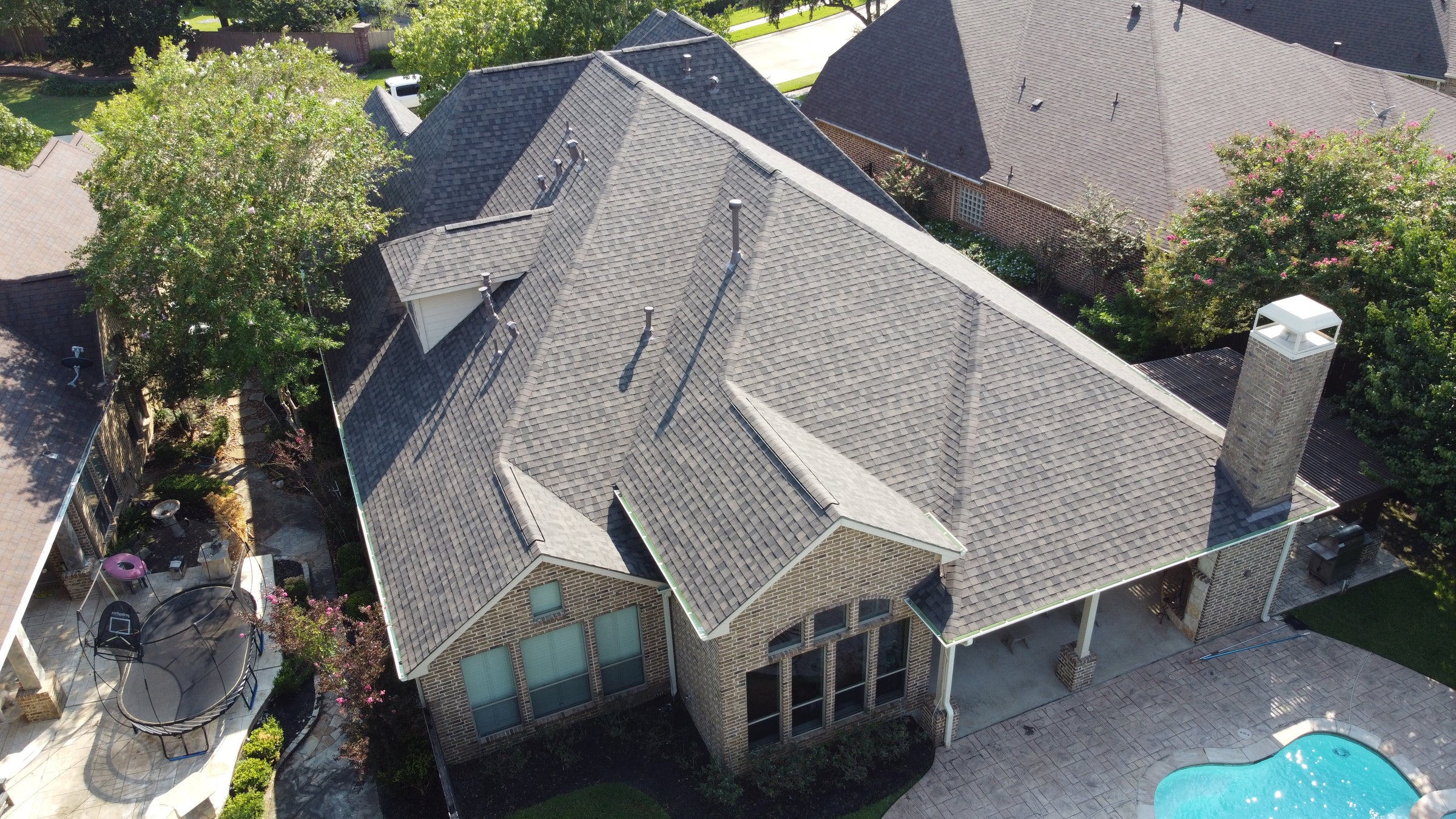 Aerial view of a roof replaced by Prime Property Builders.