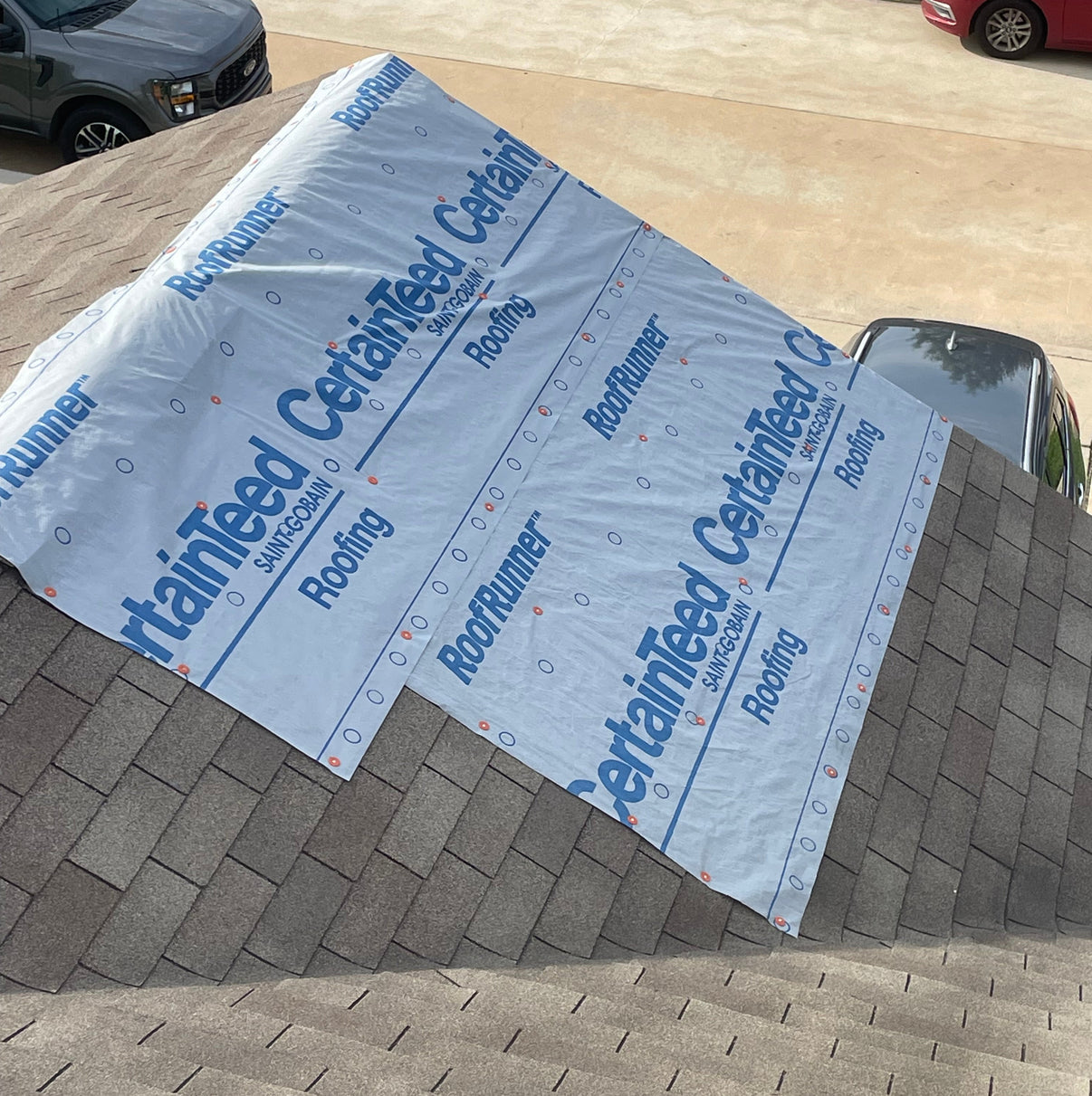 Temporary tarp used as emergency protection after storm-related roof damage